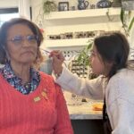 Pamelya Herndon enjoying face painting with the youth in New Mexico