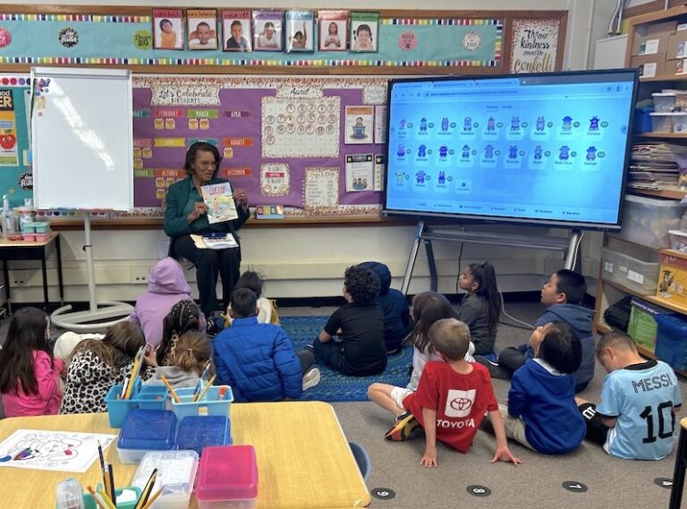 Pamelya speaking with elementary students